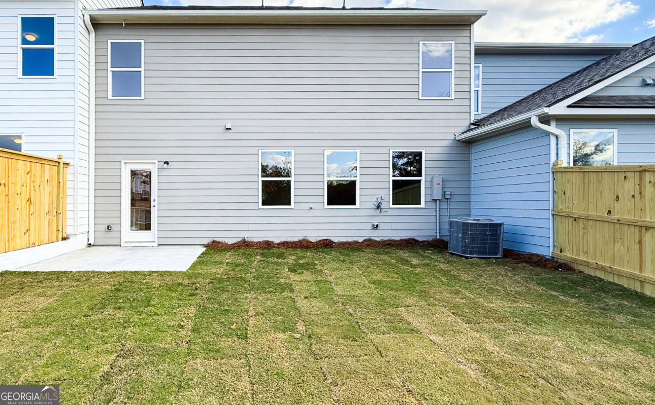 32 Umber Lane Newnan, GA 30263 - Photo 8 of 8 a view of a backyard with a garden