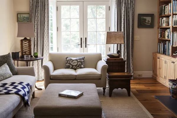 a living room with furniture and a window