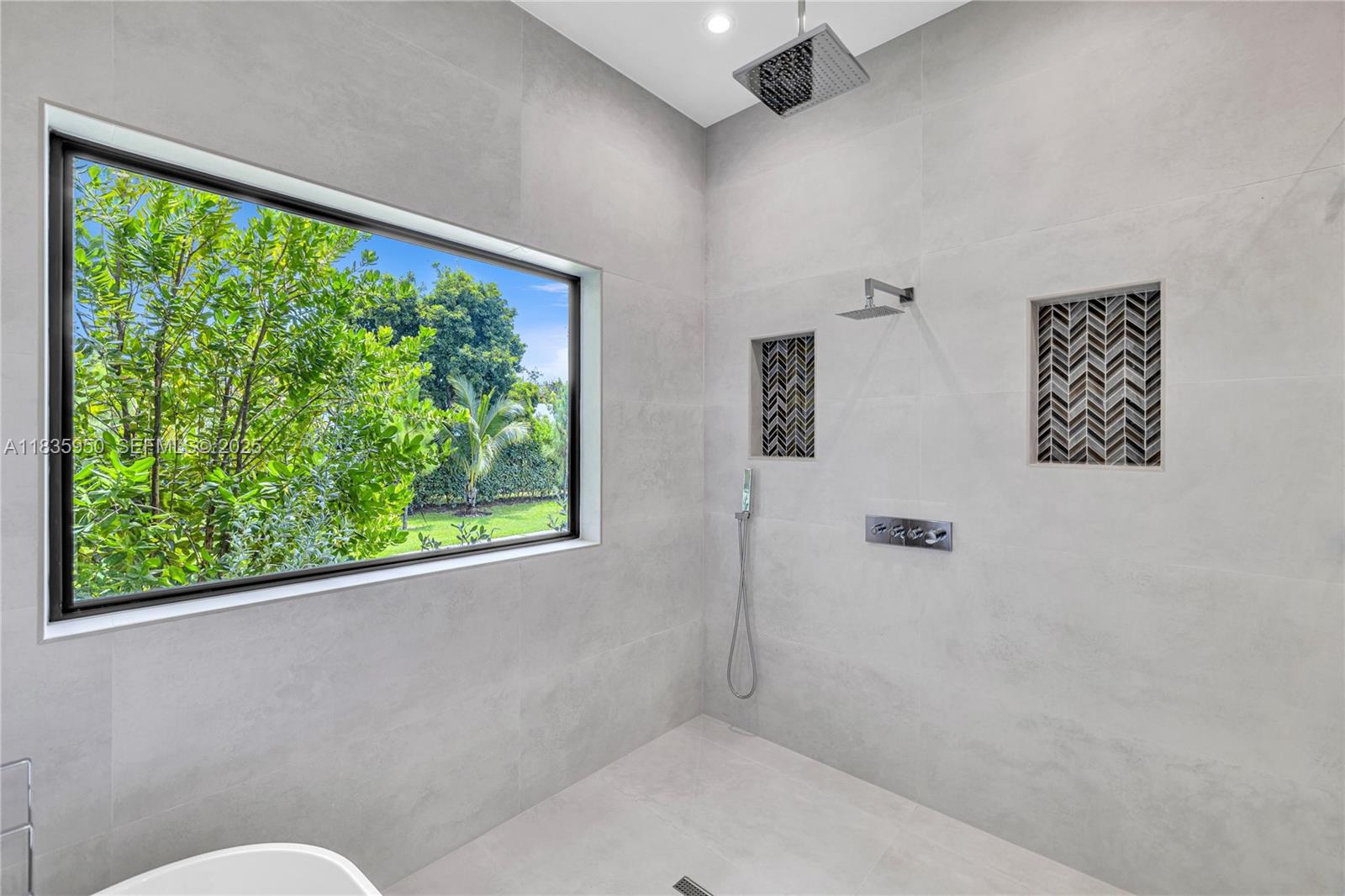 7699 Southwest 118th Street Pinecrest, FL 33156 - Photo 17 of 38 a bathroom with a toilet and a large window