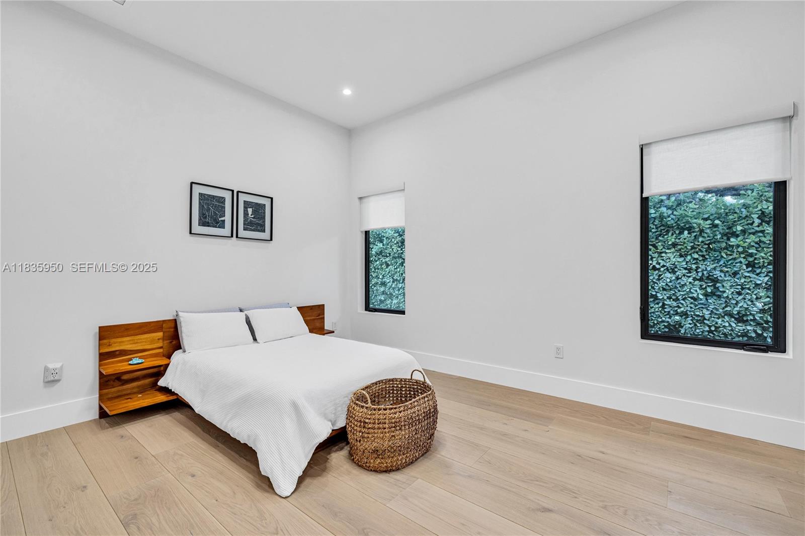 7699 Southwest 118th Street Pinecrest, FL 33156 - Photo 20 of 38 a bedroom with a bed and a chair