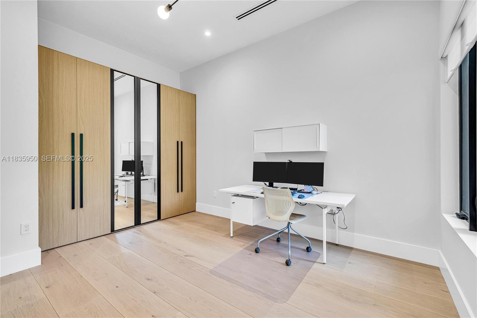 7699 Southwest 118th Street Pinecrest, FL 33156 - Photo 23 of 38 a workspace with a window and bathroom