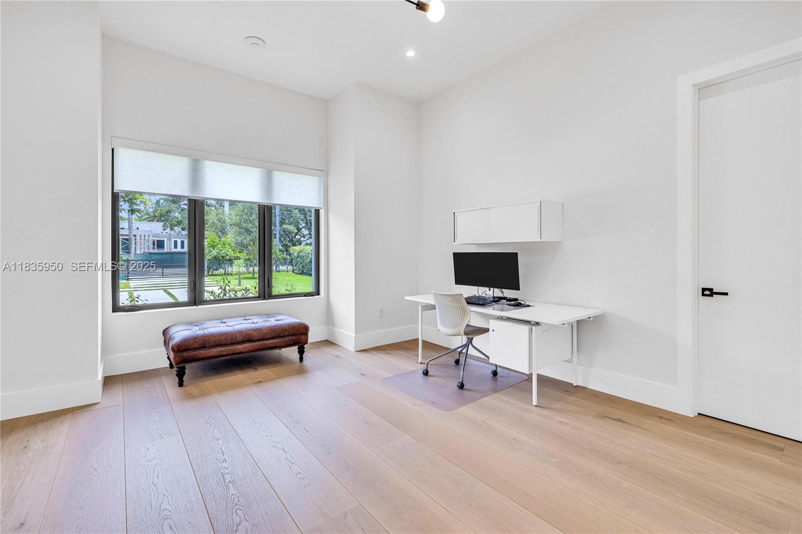 7699 Southwest 118th Street Pinecrest, FL 33156 - Photo 24 of 38 a living room with furniture and a wooden floor