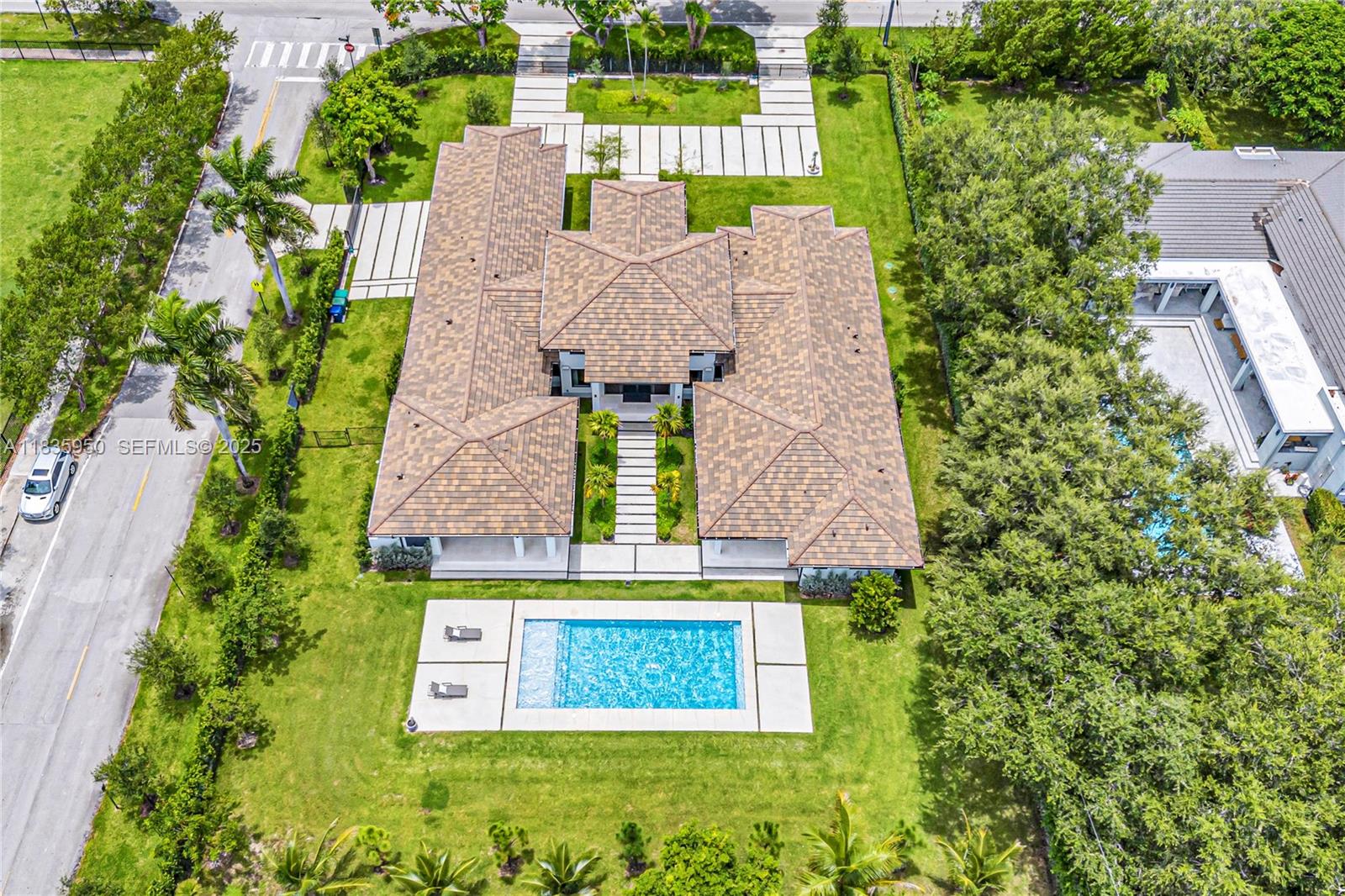 7699 Southwest 118th Street Pinecrest, FL 33156 - Photo 37 of 38 an aerial view of a house with a yard