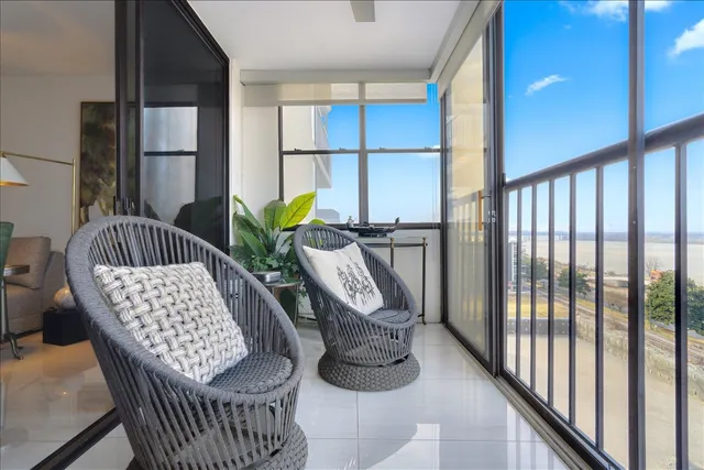 a view of balcony with furniture