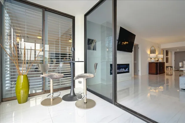 a kitchen with a sink and a glass door
