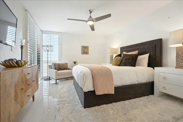 a bedroom with a bed and a couch