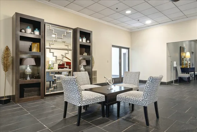 a view of a livingroom with furniture and windows