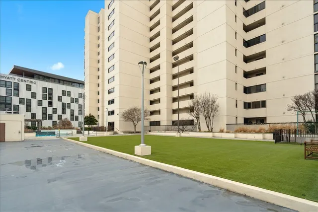 a view of building with yard