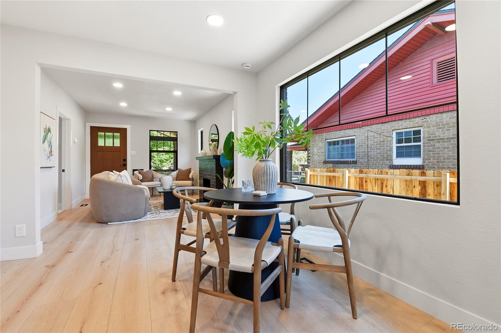 4545 Decatur Street Denver, CO 80211 - Photo 7 of 30 a view of a dining room with furniture window and wooden floor