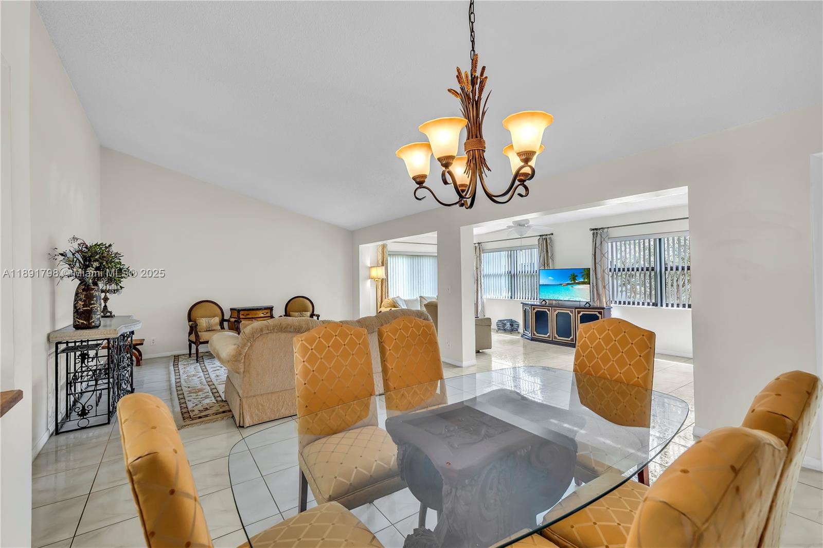 2000 Southwest 15th Place Deerfield Beach, FL 33442 - Photo 11 of 33 a living room with furniture chandelier and kitchen view