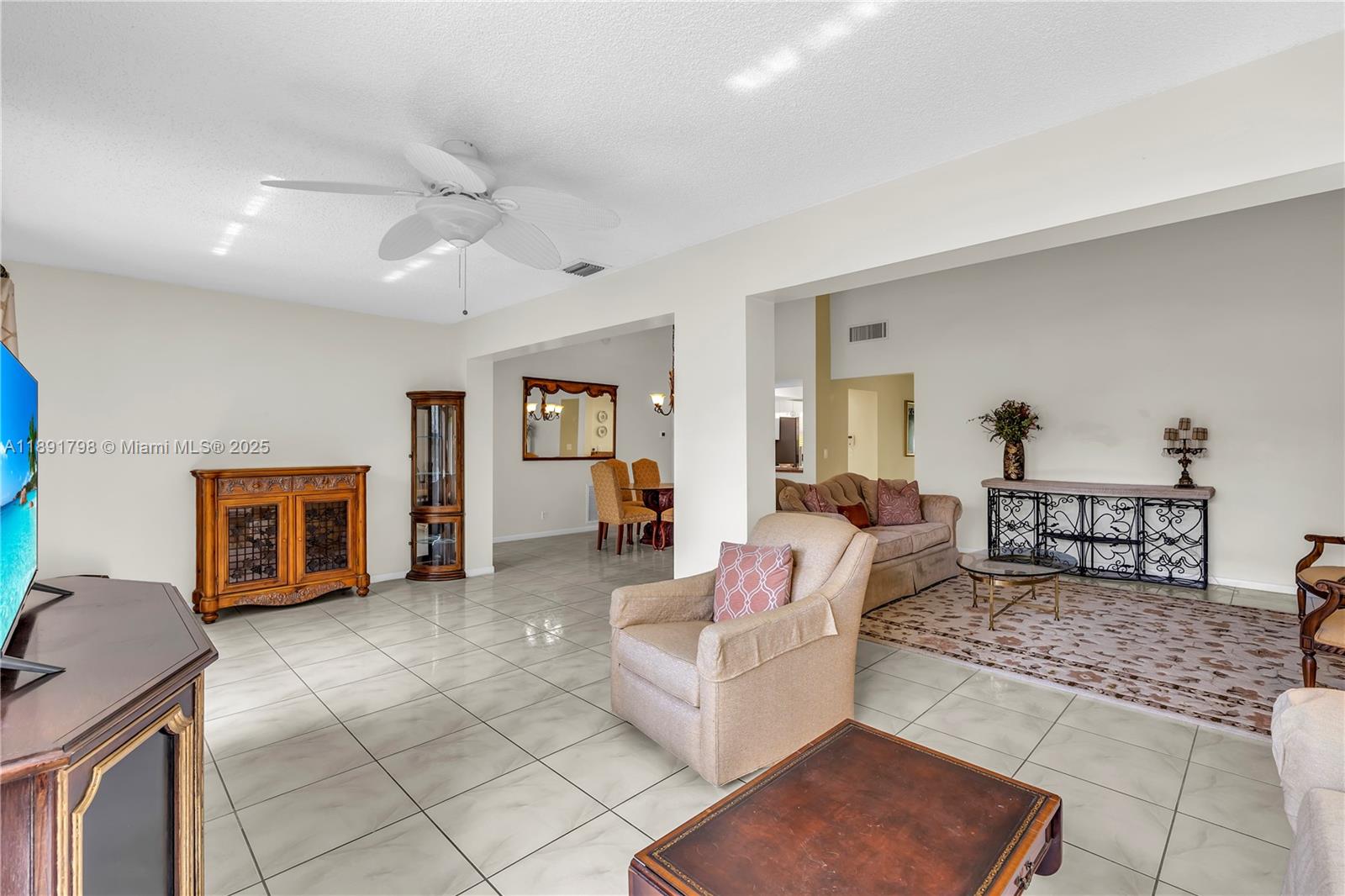 2000 Southwest 15th Place Deerfield Beach, FL 33442 - Photo 18 of 33 a living room with furniture and a table