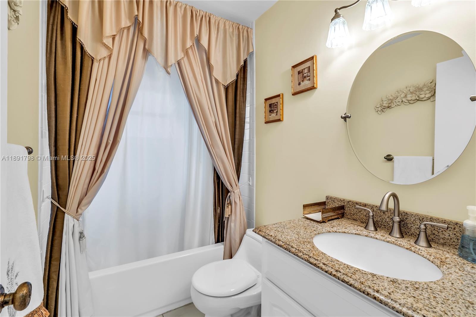 2000 Southwest 15th Place Deerfield Beach, FL 33442 - Photo 20 of 33 a bathroom with a granite countertop sink toilet and a mirror