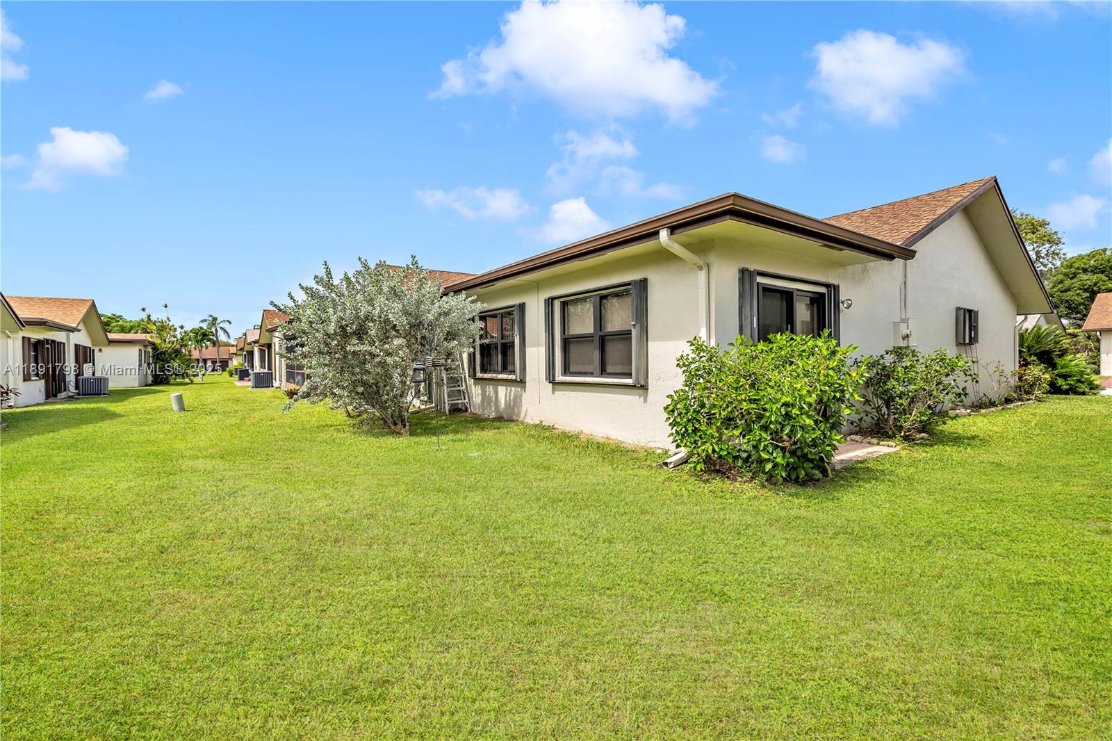 2000 Southwest 15th Place Deerfield Beach, FL 33442 - Photo 26 of 33 a front view of house with yard and green space