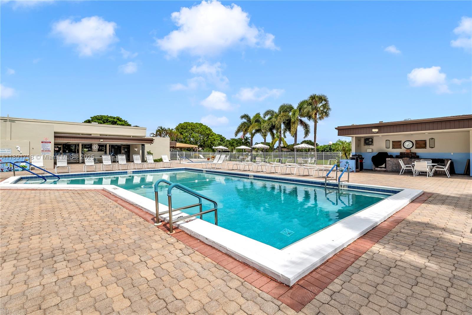 2000 Southwest 15th Place Deerfield Beach, FL 33442 - Photo 29 of 33 a view of a swimming pool with a patio