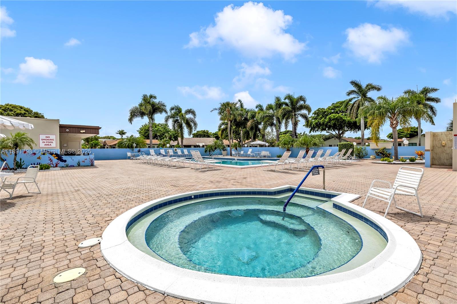 2000 Southwest 15th Place Deerfield Beach, FL 33442 - Photo 30 of 33 a view of a swimming pool with a patio