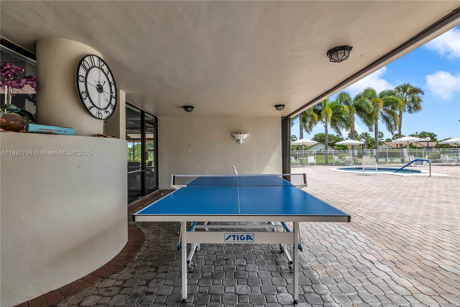 2000 Southwest 15th Place Deerfield Beach, FL 33442 - Photo 31 of 33 a view of a tables and chair with potted plants