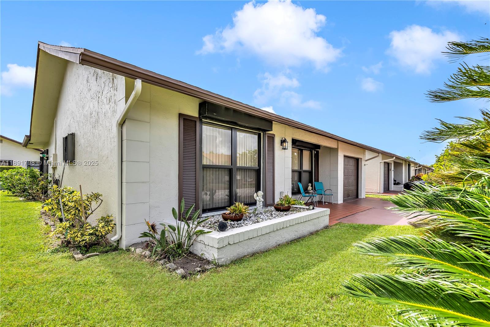 2000 Southwest 15th Place Deerfield Beach, FL 33442 - Photo 4 of 33 a swimming pool with outdoor seating and yard