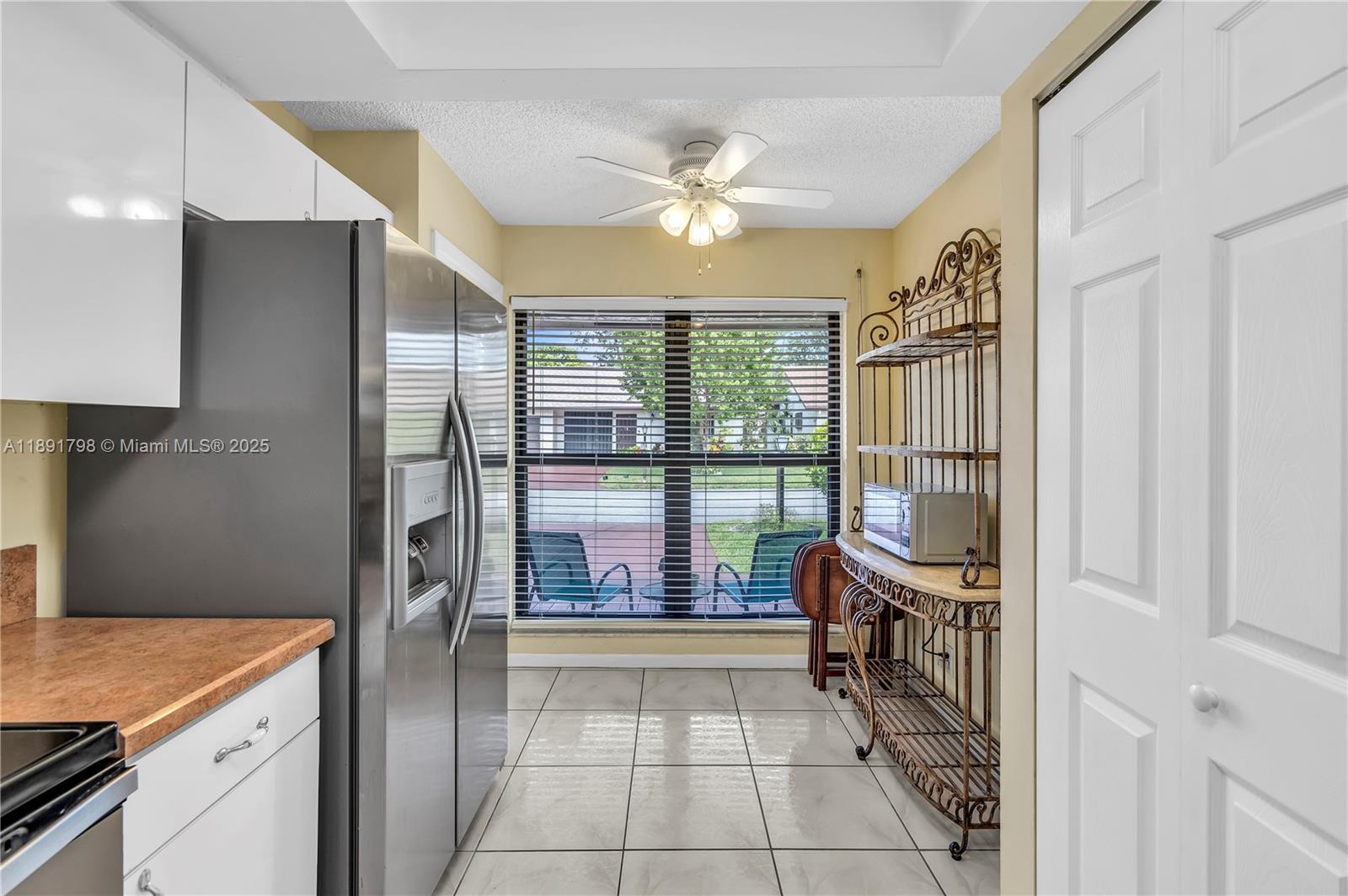 2000 Southwest 15th Place Deerfield Beach, FL 33442 - Photo 8 of 33 a room with a chandelier and furniture