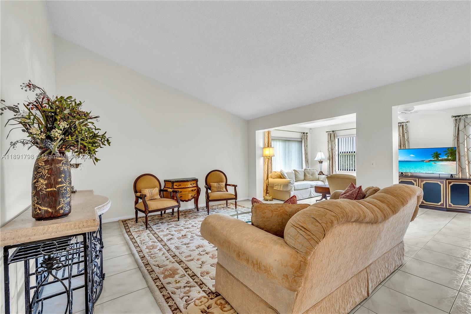 2000 Southwest 15th Place Deerfield Beach, FL 33442 - Photo 9 of 33 a living room with furniture a couch and potted plants