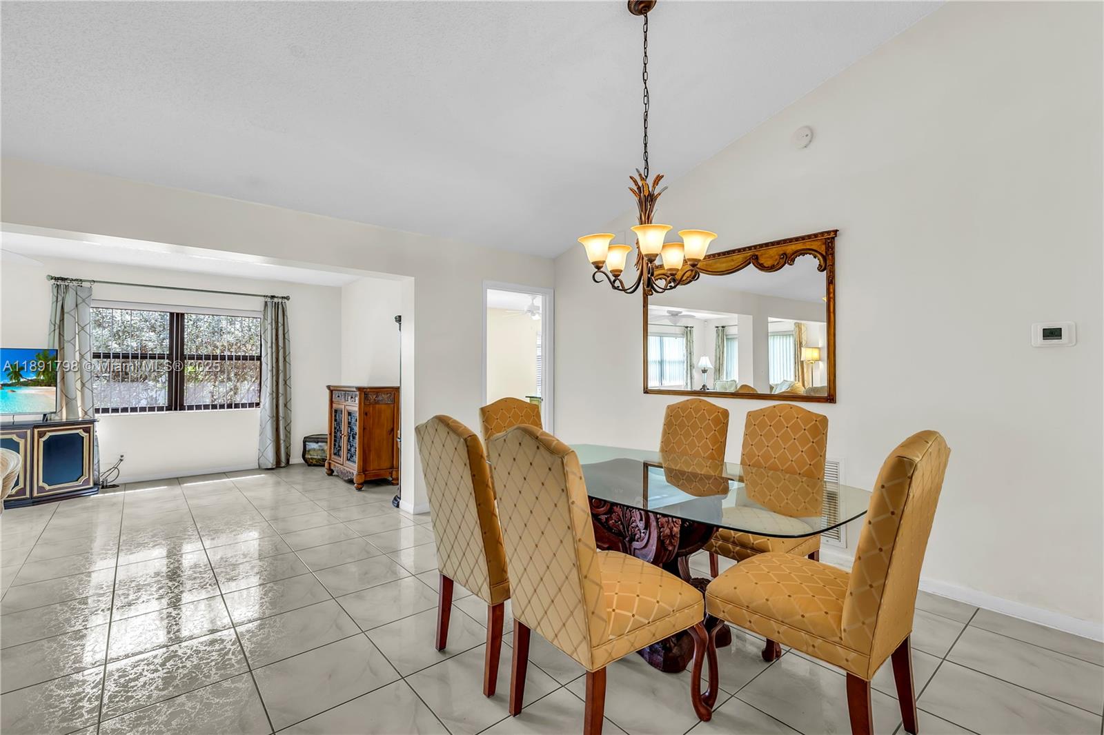 2000 Southwest 15th Place Deerfield Beach, FL 33442 - Photo 10 of 33 a dining room with furniture and window