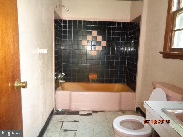 17 Tilbury Road Salem, NJ 08079 - Photo 13 of 17 a bathroom with a sink toilet and shower