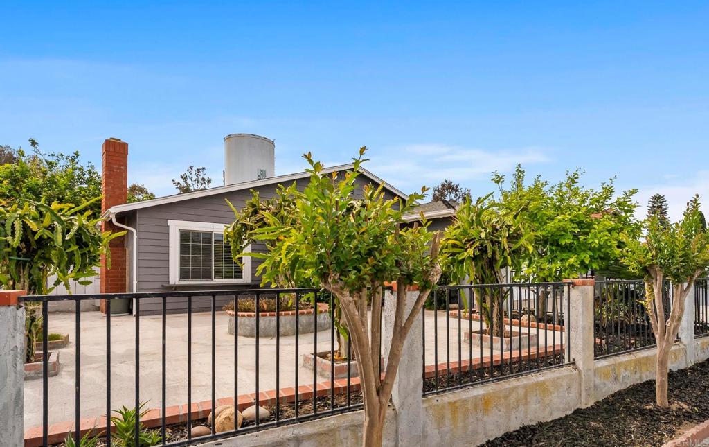 1850 Paradise Hills Road San Diego, CA 92114 - Photo 1 of 39 a view of a house with a street from a balcony