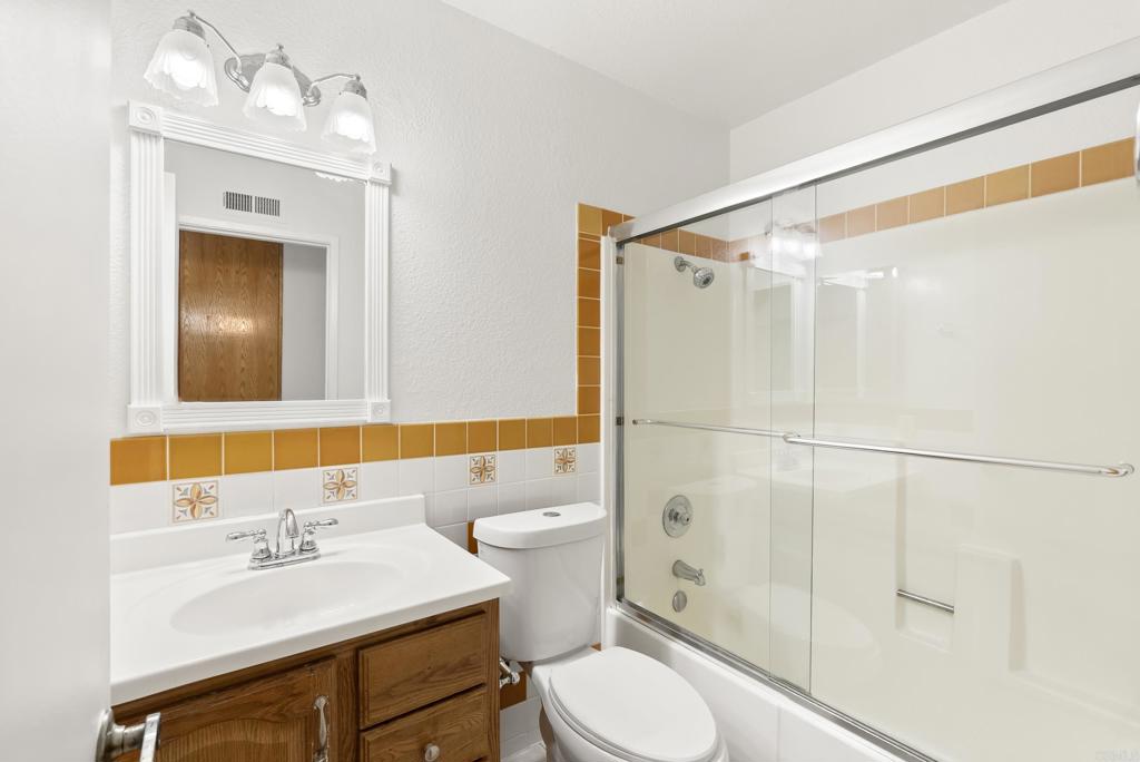 1850 Paradise Hills Road San Diego, CA 92114 - Photo 32 of 39 a bathroom with a sink a toilet and shower