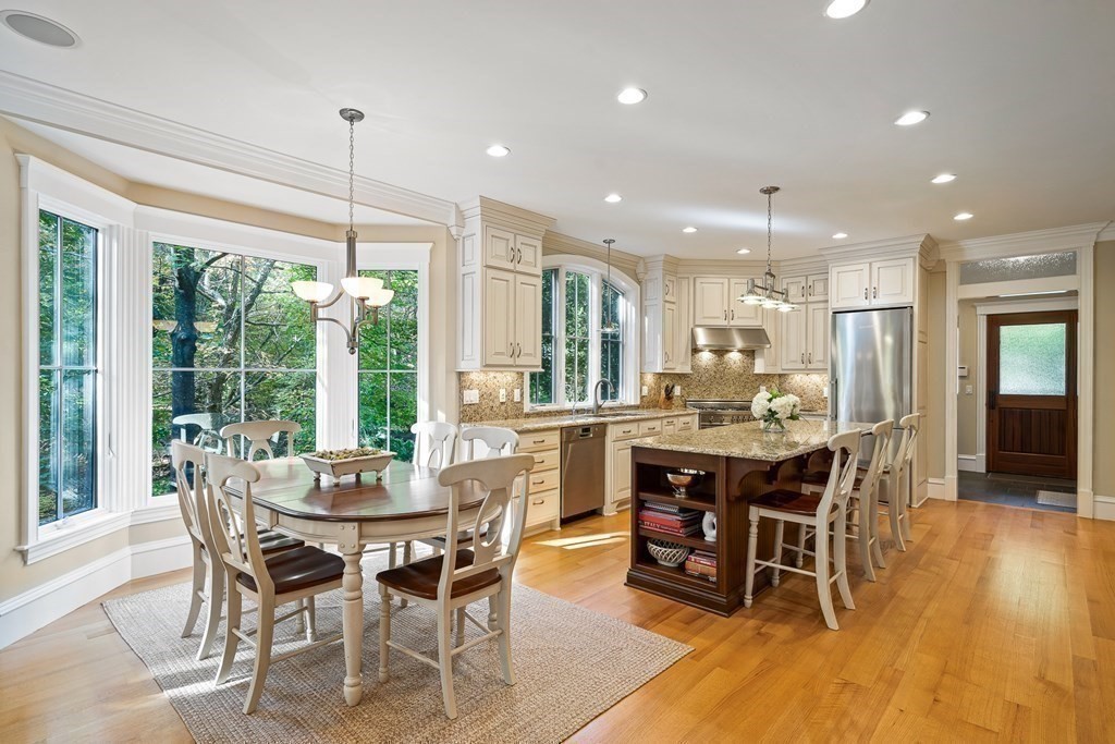 22 McCall Road Winchester, MA 01890 - Photo 11 of 40 a dining room with furniture window and wooden floor