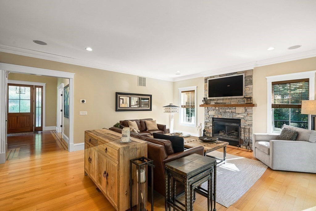 22 McCall Road Winchester, MA 01890 - Photo 14 of 40 a living room with furniture or fireplace and a flat screen tv