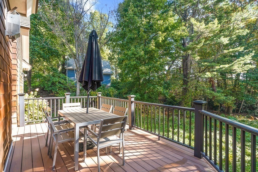 22 McCall Road Winchester, MA 01890 - Photo 16 of 40 a view of a patio with a table and chairs