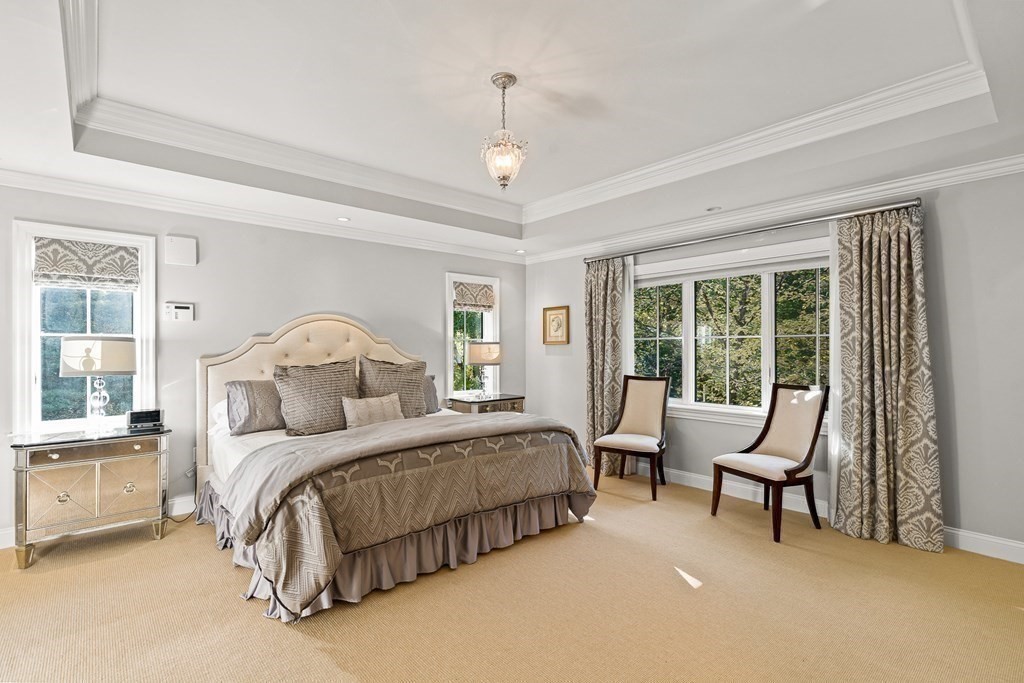 22 McCall Road Winchester, MA 01890 - Photo 21 of 40 a bedroom with a bed chairs and a window