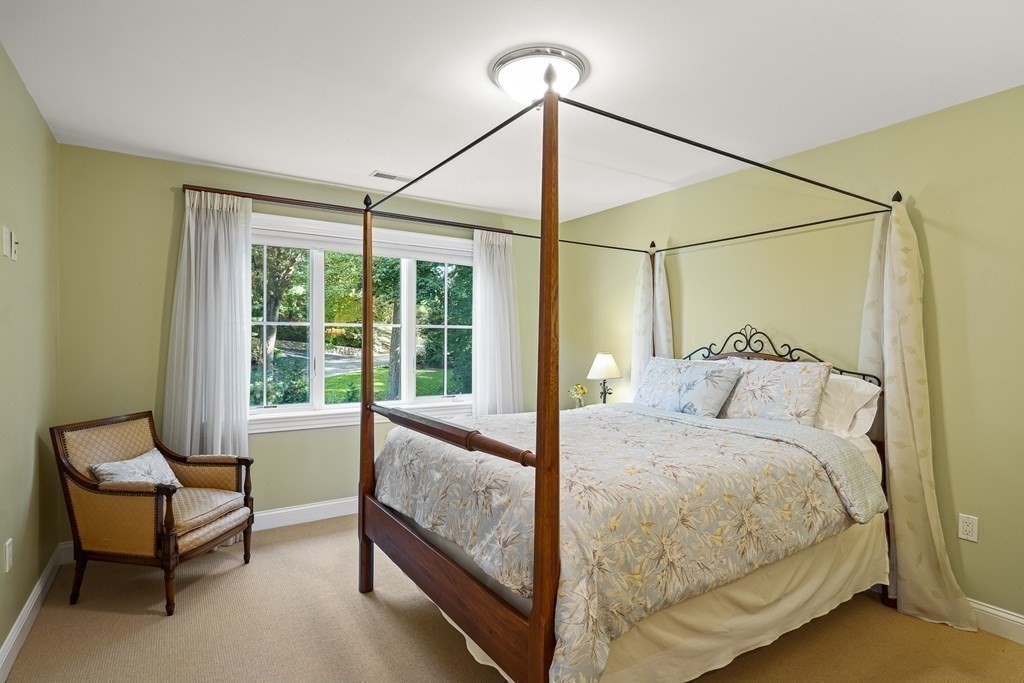 22 McCall Road Winchester, MA 01890 - Photo 27 of 40 a bedroom with a bed and a window