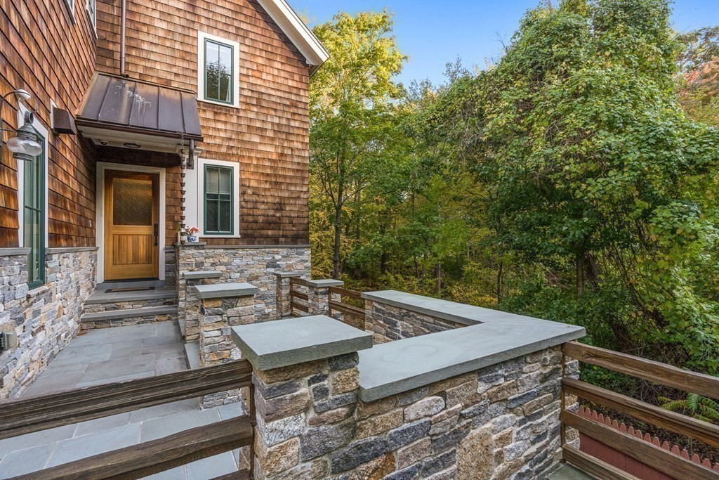 22 McCall Road Winchester, MA 01890 - Photo 3 of 40 a view of backyard with seating area