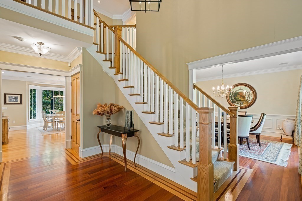 22 McCall Road Winchester, MA 01890 - Photo 7 of 40 a view of entryway and hall with wooden floor