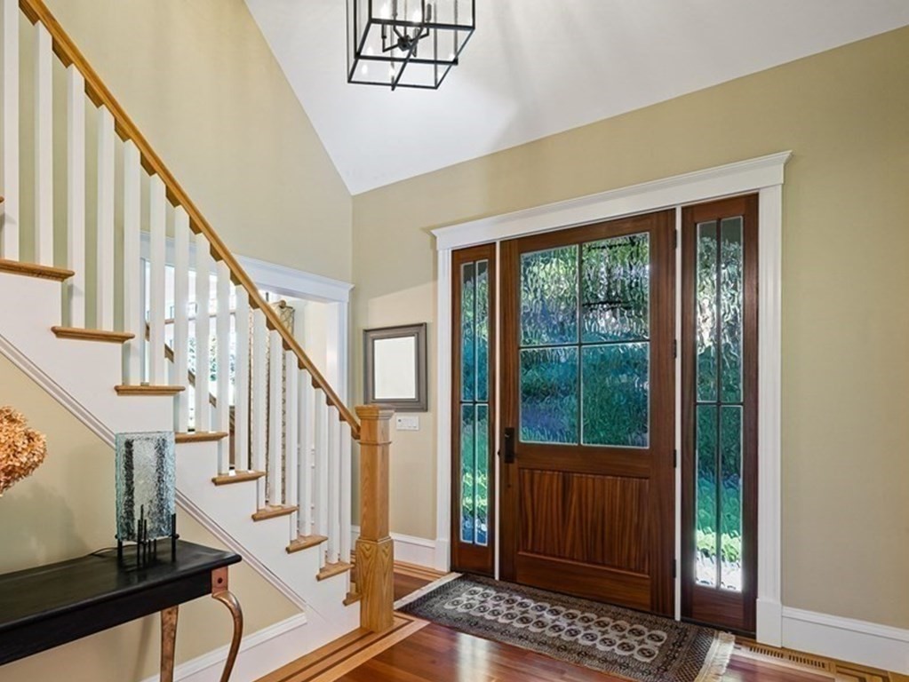 22 McCall Road Winchester, MA 01890 - Photo 8 of 40 a view of an entryway with wooden floor and door