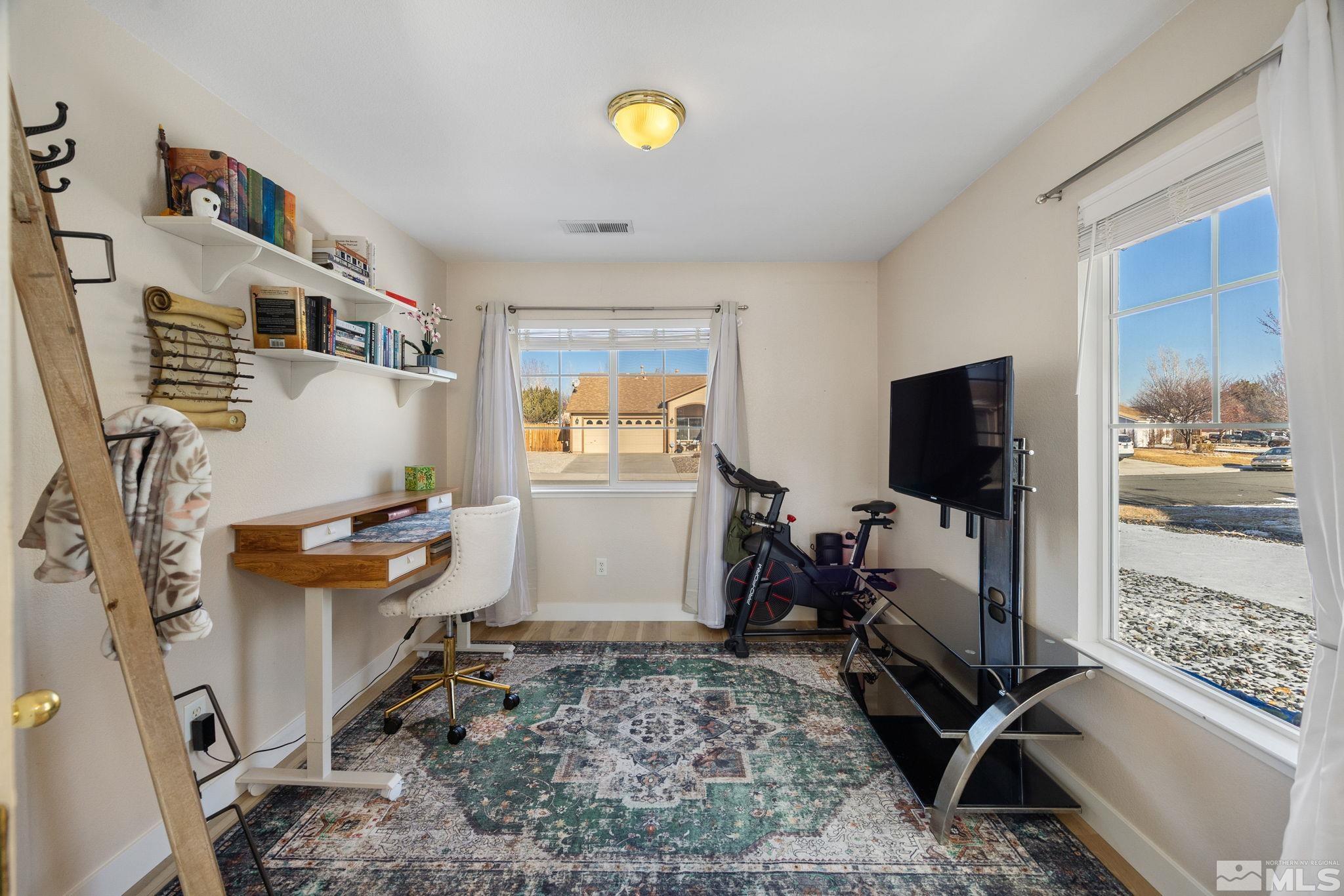224 Bartmess Boulevard Sparks, NV 89436 - Photo 11 of 20 a living room with furniture and a flat screen tv