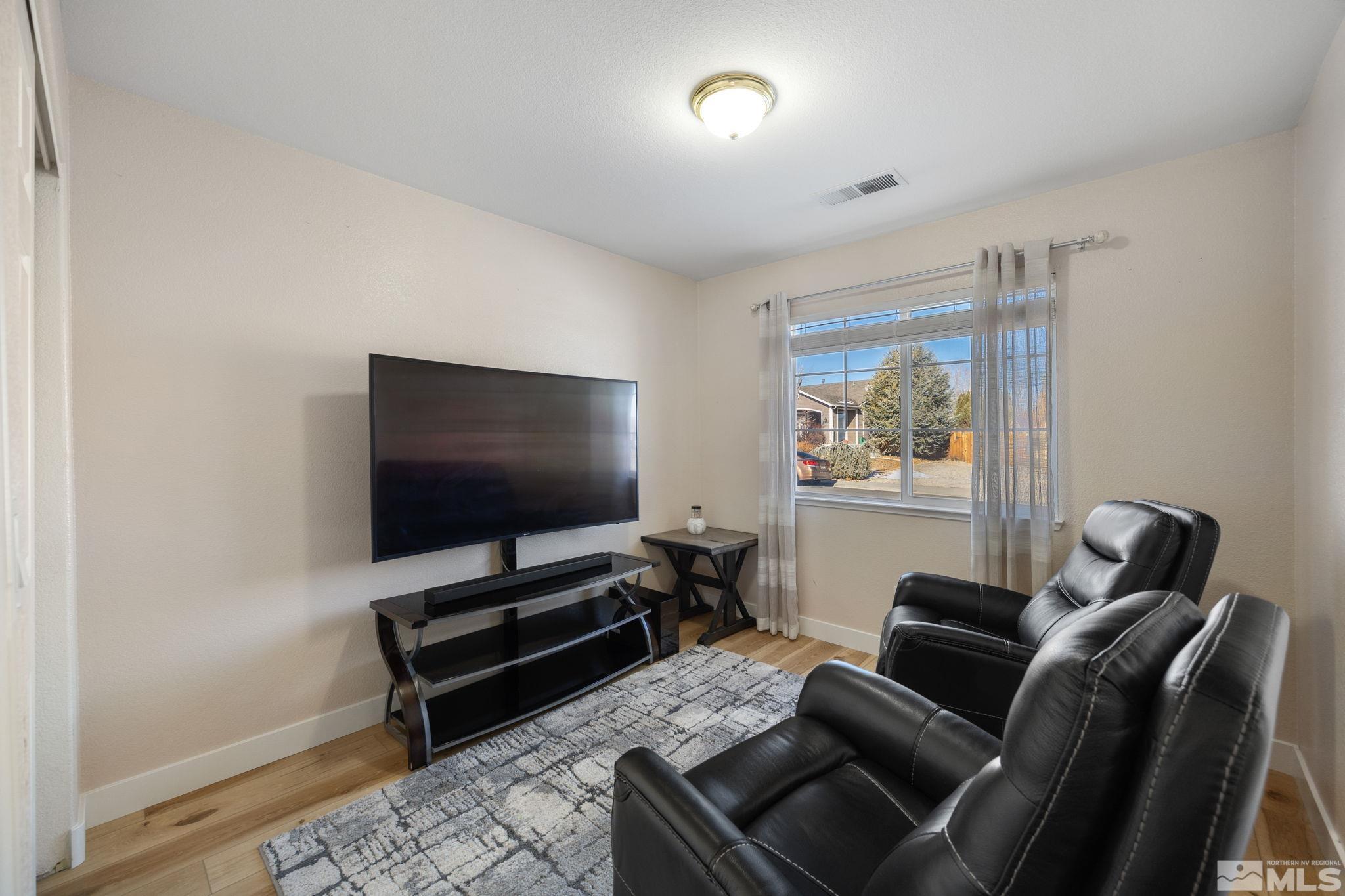 224 Bartmess Boulevard Sparks, NV 89436 - Photo 12 of 20 a living room with furniture and a flat screen tv