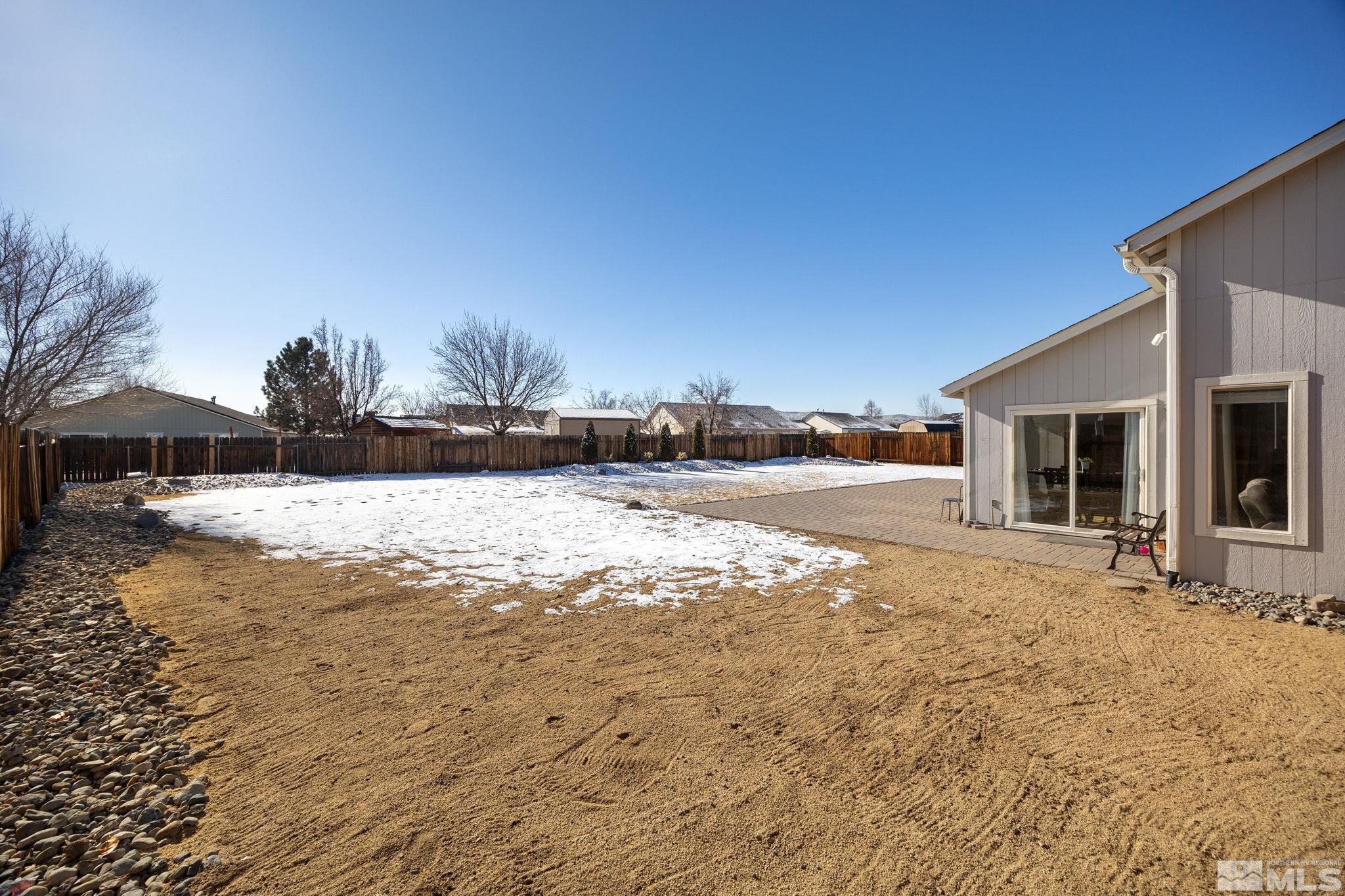224 Bartmess Boulevard Sparks, NV 89436 - Photo 16 of 20 a view of yard covered with snow in front of house