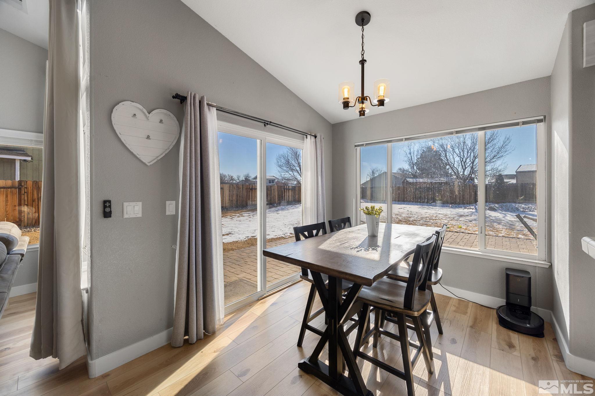 224 Bartmess Boulevard Sparks, NV 89436 - Photo 3 of 20 a view of a dining room with furniture window and wooden floor