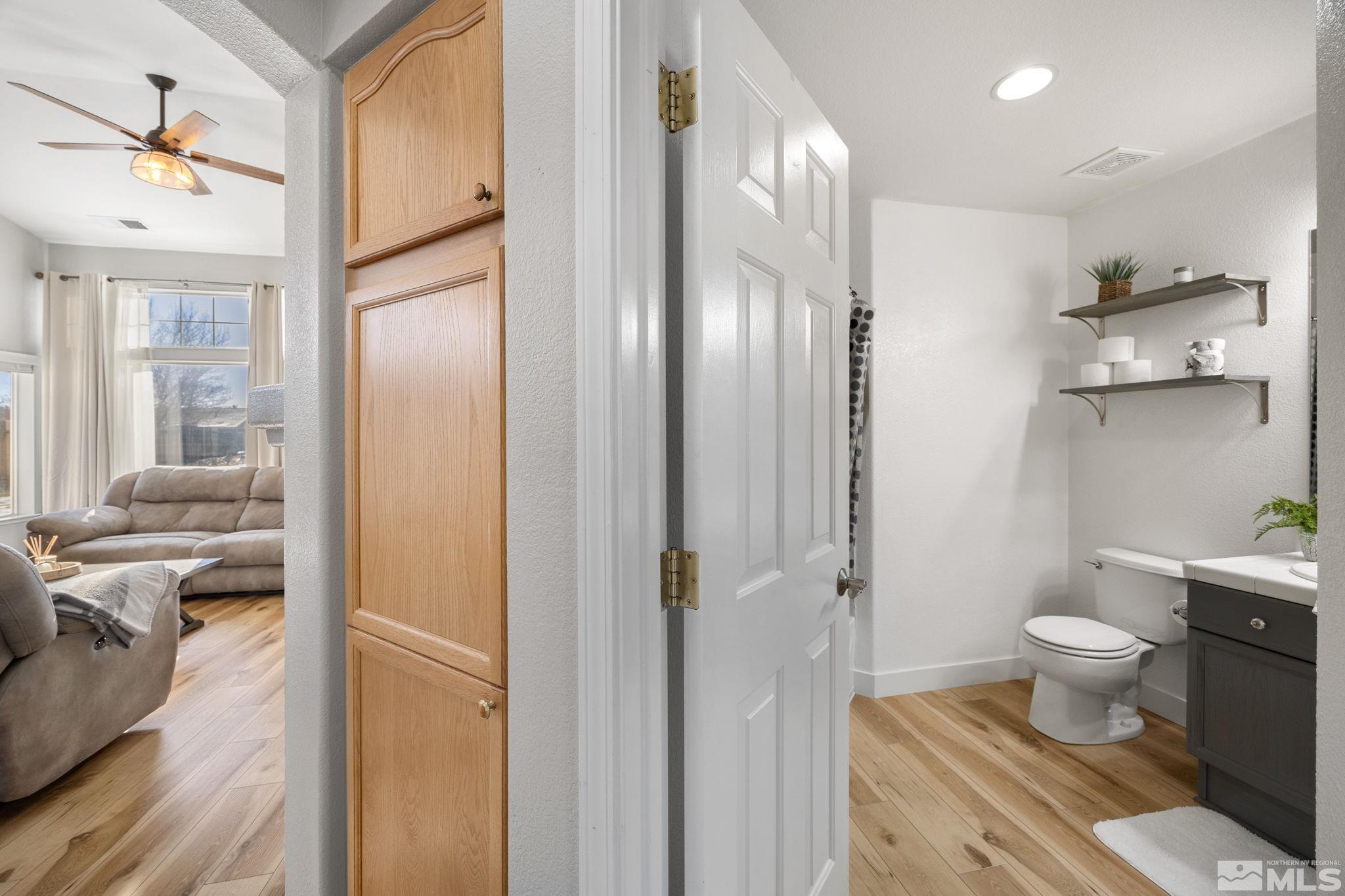 224 Bartmess Boulevard Sparks, NV 89436 - Photo 7 of 20 a spacious bathroom with a toilet sink and a mirror