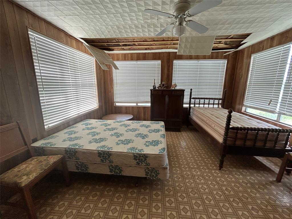 410 County Road 433 Mullin, TX 76864 - Photo 14 of 22 a bedroom with a bed chair and window