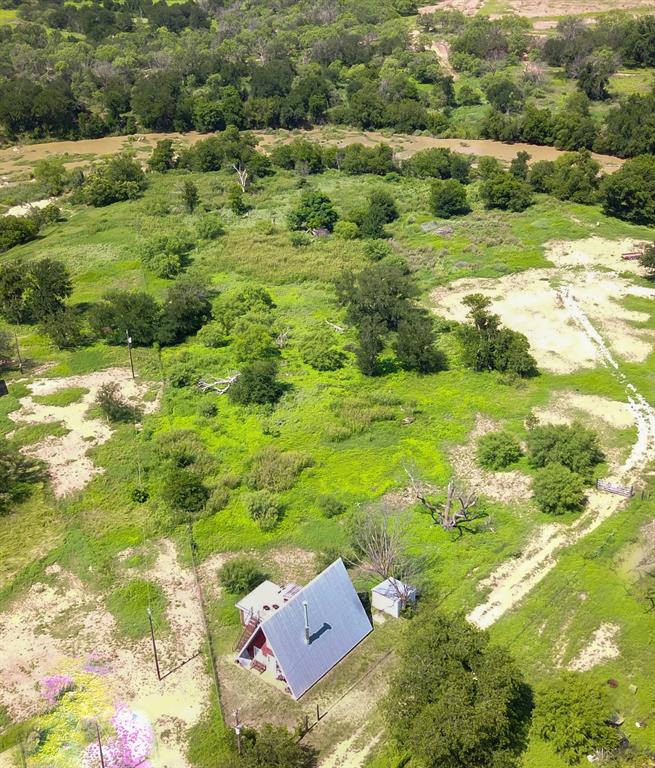 410 County Road 433 Mullin, TX 76864 - Photo 2 of 22 a view of a garden with a houses