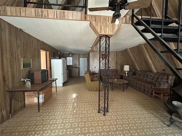 a view of a livingroom with furniture and a rug