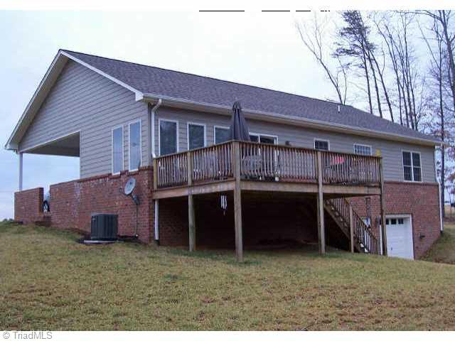 854 Smith Road Mount Airy, NC 27030 - Photo 3 of 9 Other. Rear of home has well built deck and basement garage door.
