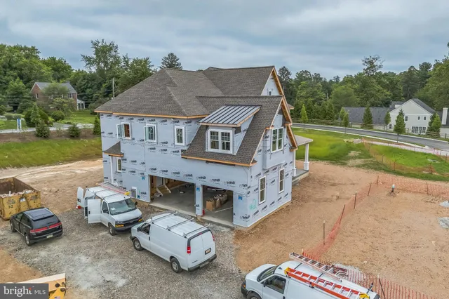 a aerial view of a house with a yard