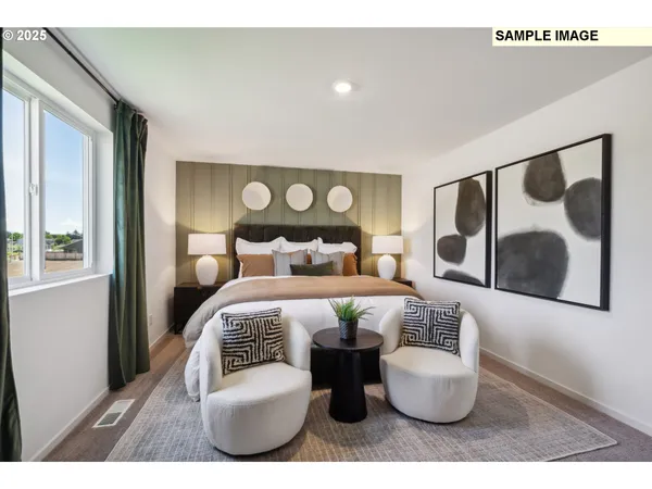 a bedroom with a large bed and a couch