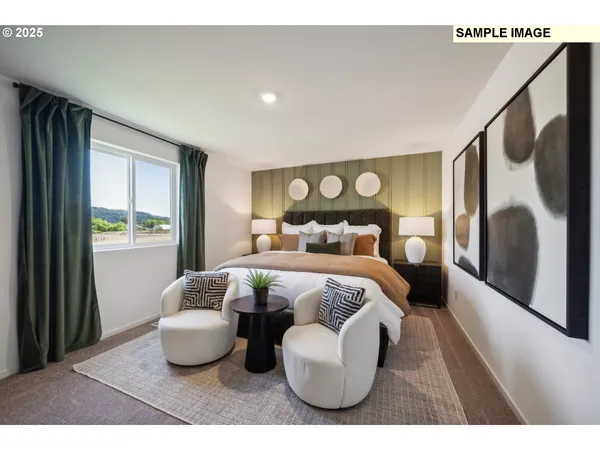 a bedroom with a bed and a large mirror