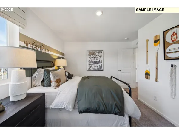 a bedroom with a bed and a table