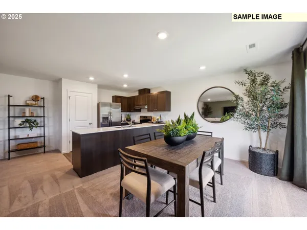 a kitchen with a table and chairs