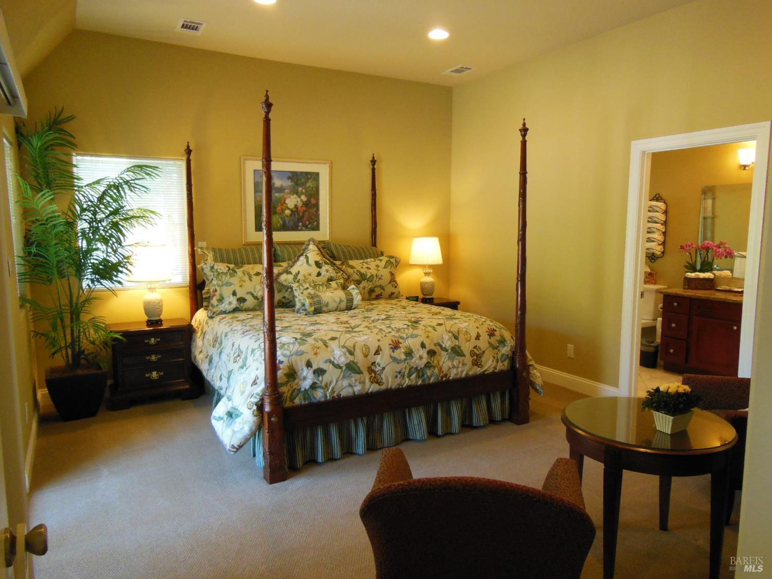 3093 Old Lawley Toll Road Calistoga, CA 94515 - Photo 8 of 17 a bedroom with a bed and a table